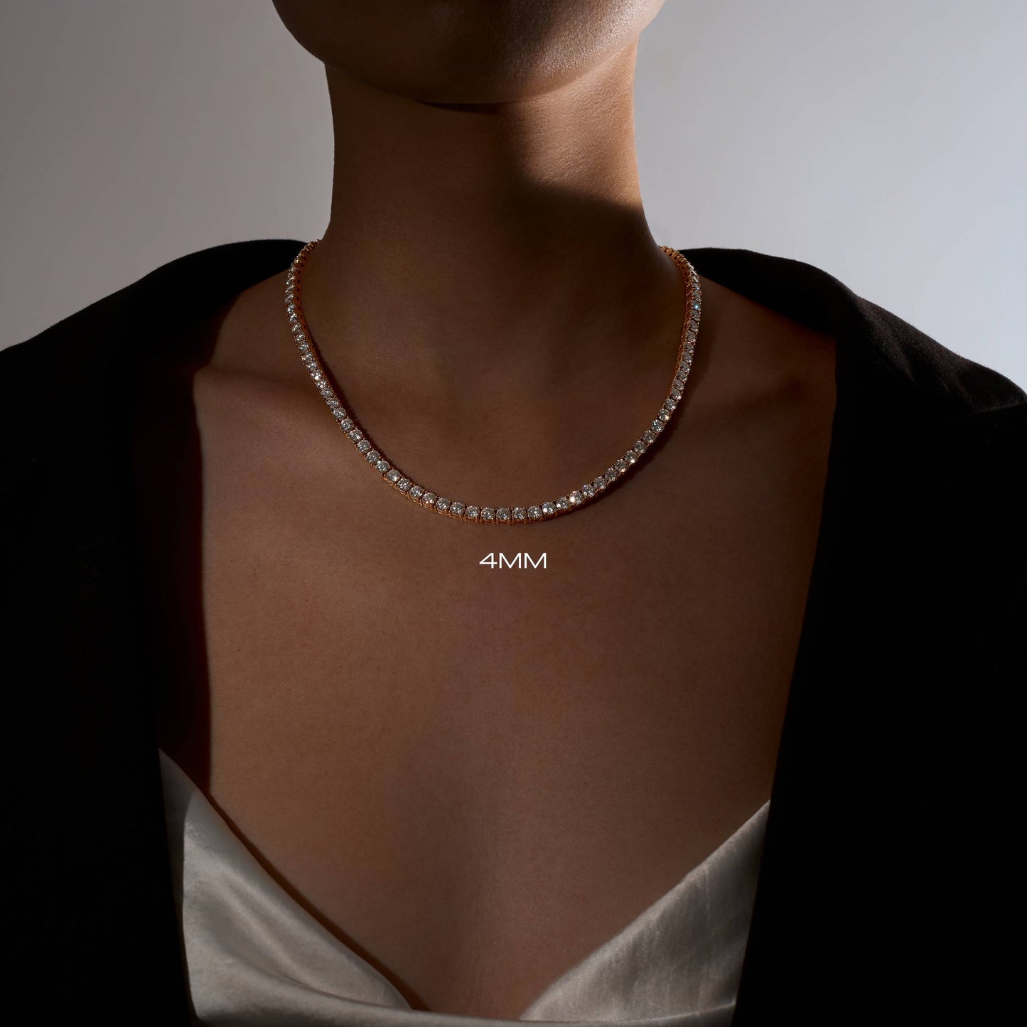 Lady wearing a 4mm 18k gold plated tennis necklace 