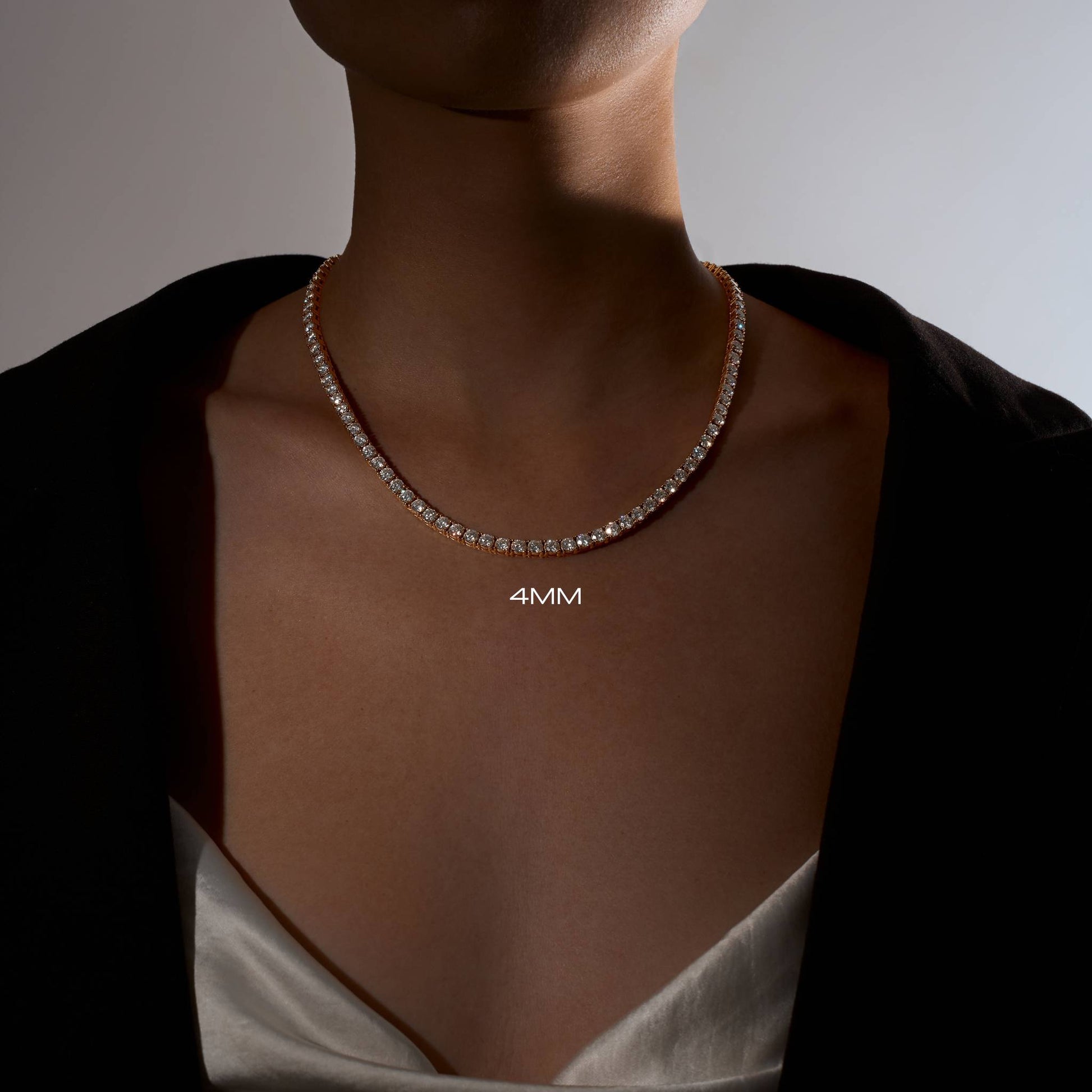 Lady wearing a 4mm 18k gold plated tennis necklace 